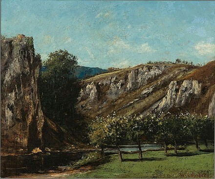 Mountainous landscape with fruit trees in Ornans.jpg